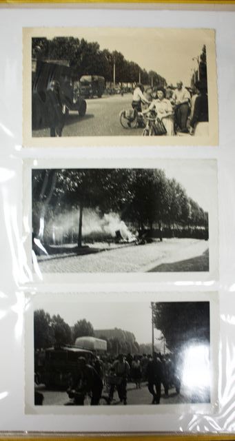 ENVIRON 23 PHOTOS DE PARIS SOUS L'OCCUPATION DANS UN CLASSEUR. NOTAMMENT LE DEFILE DE L'ARMEE ALLEMANDE LE 14 JUIN 1940.