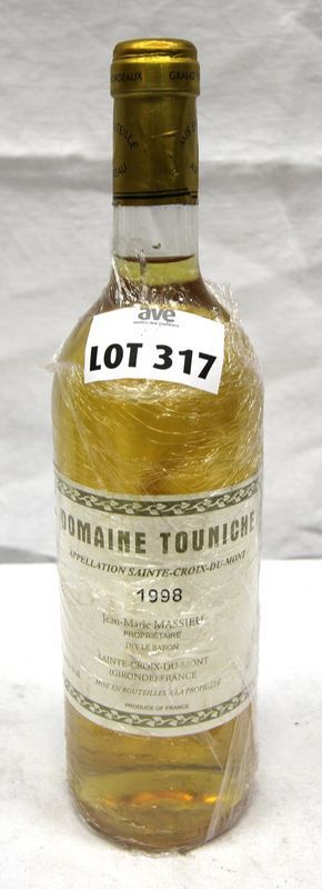 UNE BOUTEILLE DOMAINE TOUNICHE SAINTE CROIX DU MONT 1998.