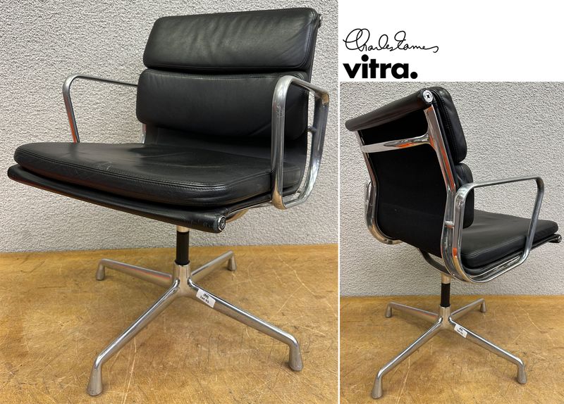 FAUTEUIL PIVOTANT DESIGN CHARLES ET RAY EAMES MODELE SOFT PAD EA208 EDITION VITRA, STRUCTURE EN ALUMINIUM, GARNITURE EN CUIR NOIR REPOSANT SUR UN PIETEMENT EN ETOILE A 4 BRANCHES SUR PATINS. USURES. 84 X 58 X 69 CM.