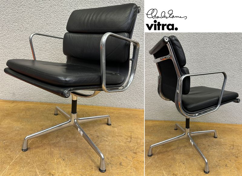 FAUTEUIL PIVOTANT DESIGN CHARLES ET RAY EAMES MODELE SOFT PAD EA208 EDITION VITRA, STRUCTURE EN ALUMINIUM, GARNITURE EN CUIR NOIR REPOSANT SUR UN PIETEMENT EN ETOILE A 4 BRANCHES SUR PATINS. USURES ET TACHE. 84 X 58 X 69 CM.