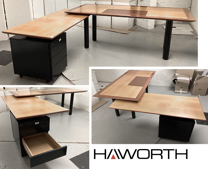 BUREAU DE DIRECTION DE MARQUE HAYWORTH COMPRENNANT UN BUREAU RECTANGULAIRE A PLATEAU EN PLAQUAGE DE BOIS VERNIS, SOUS-MAIN EN CUIR, PIETEMENT EN ACIER LAQUE NOIR (74 X 200 X 100 CM) ET 1 RETOUR REPOSANT SUR UN CAISSON A 4 TIROIRS. (70 X 165 X 70 CM). ARCUEIL 3 00 R2.