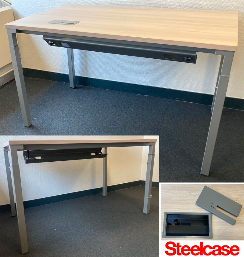 BUREAU DROIT DE MARQUE STEELCASE A PLATEAU RECTANGULAIRE EN BOIS STRATIFIE CLAIR AVEC TRAPPE TECHNIQUE REPOSANT SUR UNE STRUCTURE AVEC PASSE CABLES ET 4 PIEDS EN ACIER LAQUE GRIS. 75 X 140 X 80 CM. ACCIDENT CERTAINES TRANCHE DECOLLEES. 25 UNITES. VENDU A L'UNITE AVEC FACULTE DE REUNION. ARCUEIL 3 1