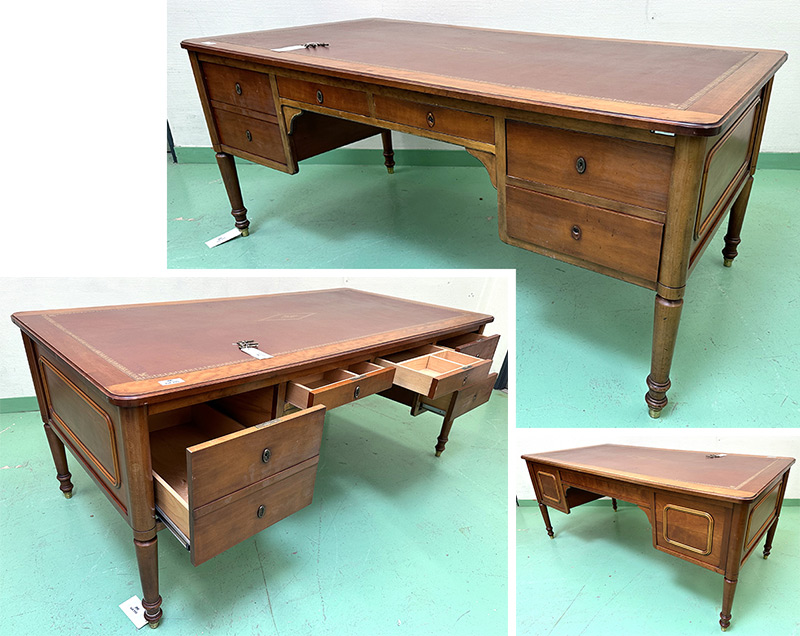 BUREAU PLAT DE STYLE LOUIS PHILIPPE EN BOIS NATUREL VERNI A PLATEAU RECTANGULAIRE, INSERT EN CUIR FAUVE SUR LE PLATEAU ET SUR LES 2 TIRETTES LATERALES, 5 TIROIRS EN CEINTURE FERMANT A CLE. VENDU AVEC 3 CLES. 76 X 190 X 90 CM. LOCALISATION : ARCUEIL RESERVE 00 SALLE 14