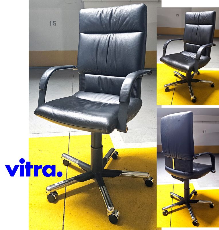 FAUTEUIL SUR ROULETTE A HAUTEUR AJUSTABLE DESIGN BELLIMI FIGURA MODELE EXECUTIVE OFFICE CHAIR EDITION VITRA ASSISE, DOSSIER ET ACCOUDOIRS EN CUIR DE COULEUR NOIR REPOSANT SUR PIETEMENT ETOILE A 5 BRANCHES EN ACIER CHROME. USURE. HAUTEUR MAX : 118 CM, HAUTEUR MIN : 105 CM, 68 X 72 CM.